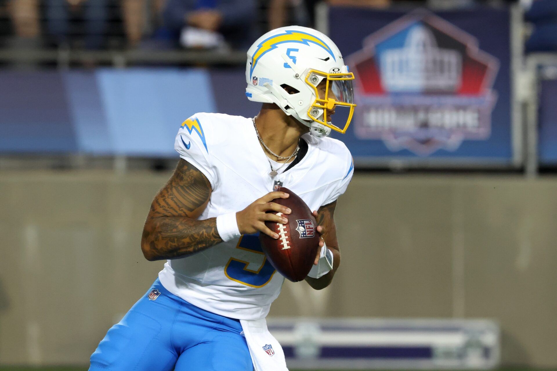 Los Angeles Chargers quarterback Trey Lance (5) looks to pass in the first quarter against the Detroit Lions at Tom Benson Hall of Fame Stadium.