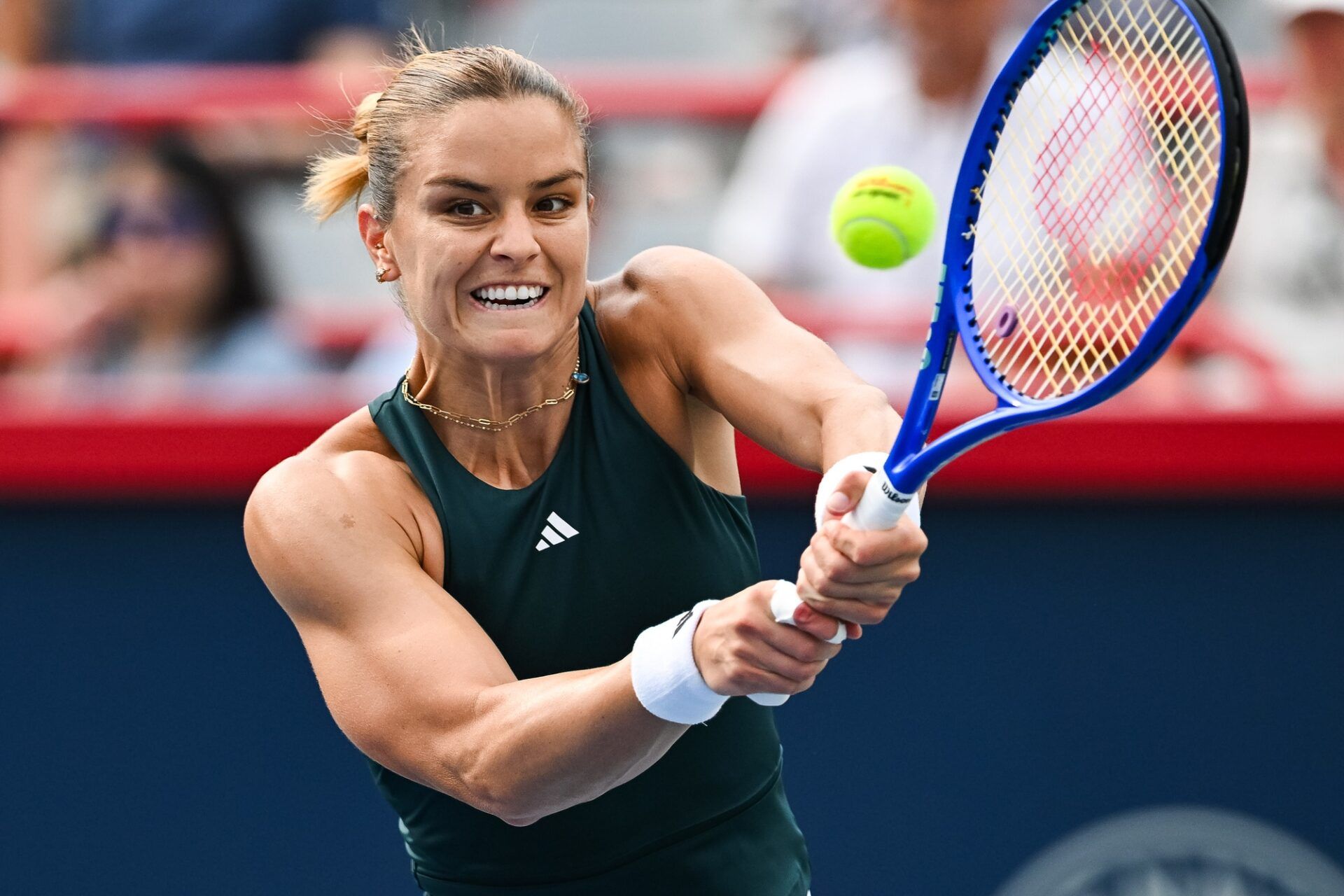 Maria Sakkari (GRE) returns the ball to Jessica Pegula (USA) in second round play at IGA Stadium.
