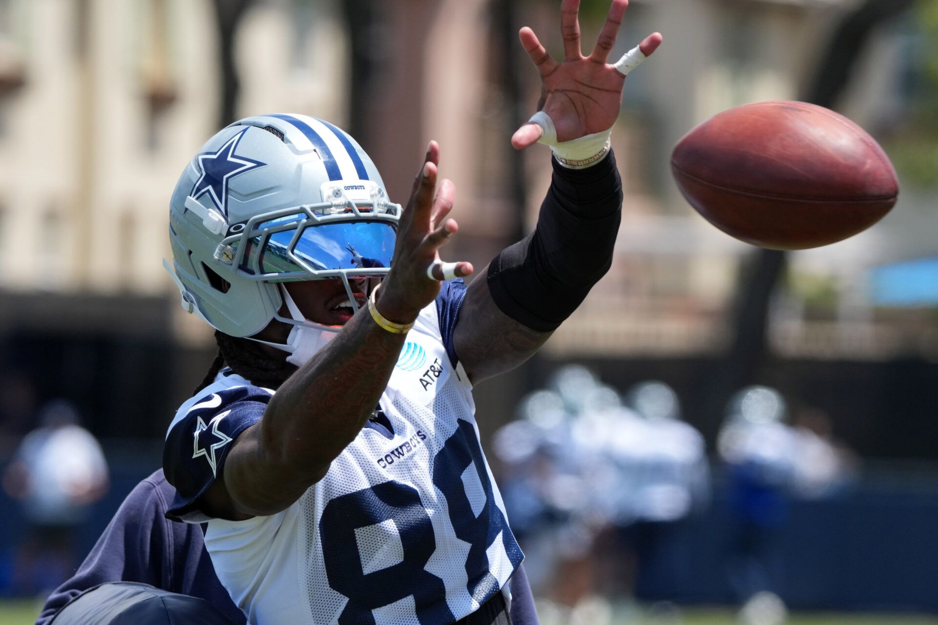 Dallas Cowboys receiver CeeDee Lamb (88) catches the ball at training camp at the River Ridge Fields.