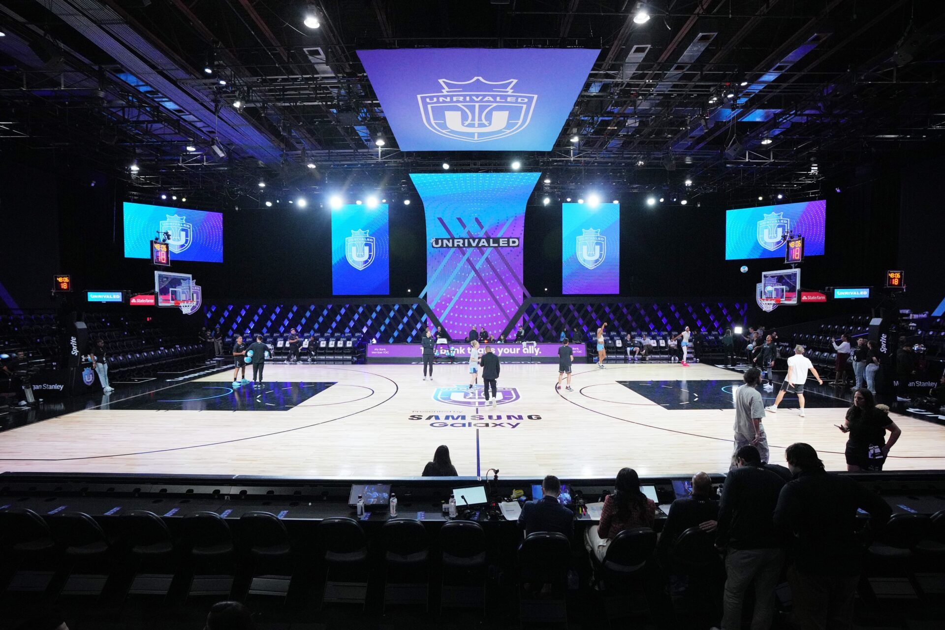 Players warm-up before the game between the Mist and the Lunar Owls of the Unrivaled women’s professional 3v3 basketball league at Wayfair Arena.