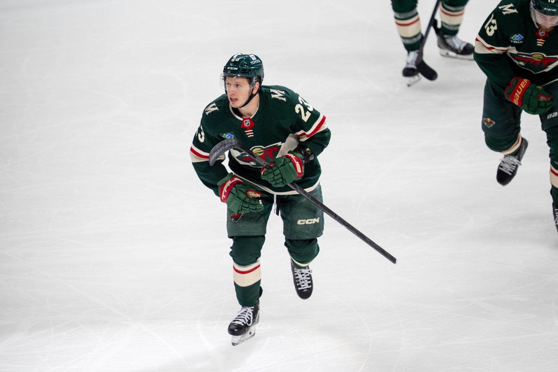 Minnesota Wild center Marco Rossi (23) leads the team to the bench after scoring against the Vegas Golden Knights in the first period in game three of the first round of the 2025 Stanley Cup Playoffs at Xcel Energy Center.