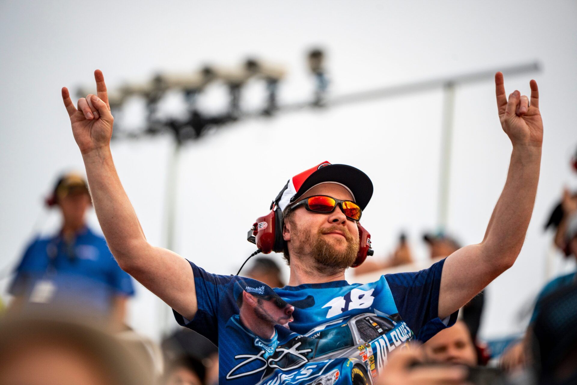 A fan cheers during the ARCA Menards Series Atlas Roofing 150 on Aug. 1, 2025, at Iowa Speedway in Newton, Iowa. Brenden Queen (28) finished first.