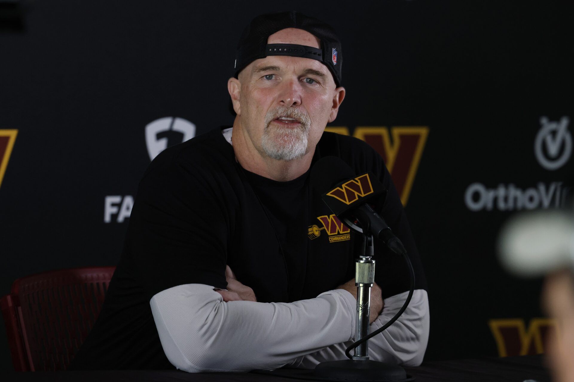 Washington Commanders head coach Dan Quinn speaks with the media prior to practice on day one of training camp at OrthoVirginia Training Center at Commanders Park.