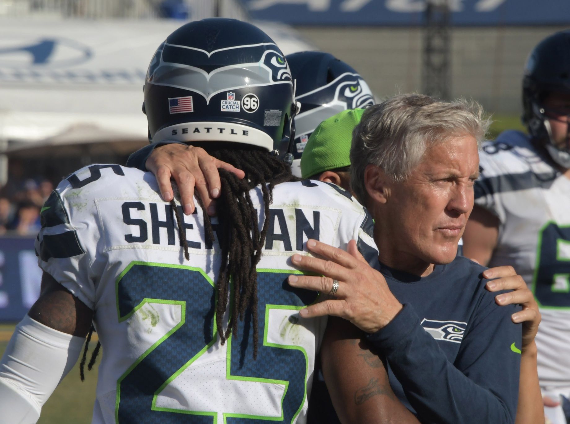 Seattle Seahawks head coach Pete Carroll (right) and cornerback Richard Sherman (25) celebrate in the final minute against the Los Angeles Rams during a NFL football game at Los Angeles Memorial Coliseum. The Seahawks defeated the Rams 16-10.