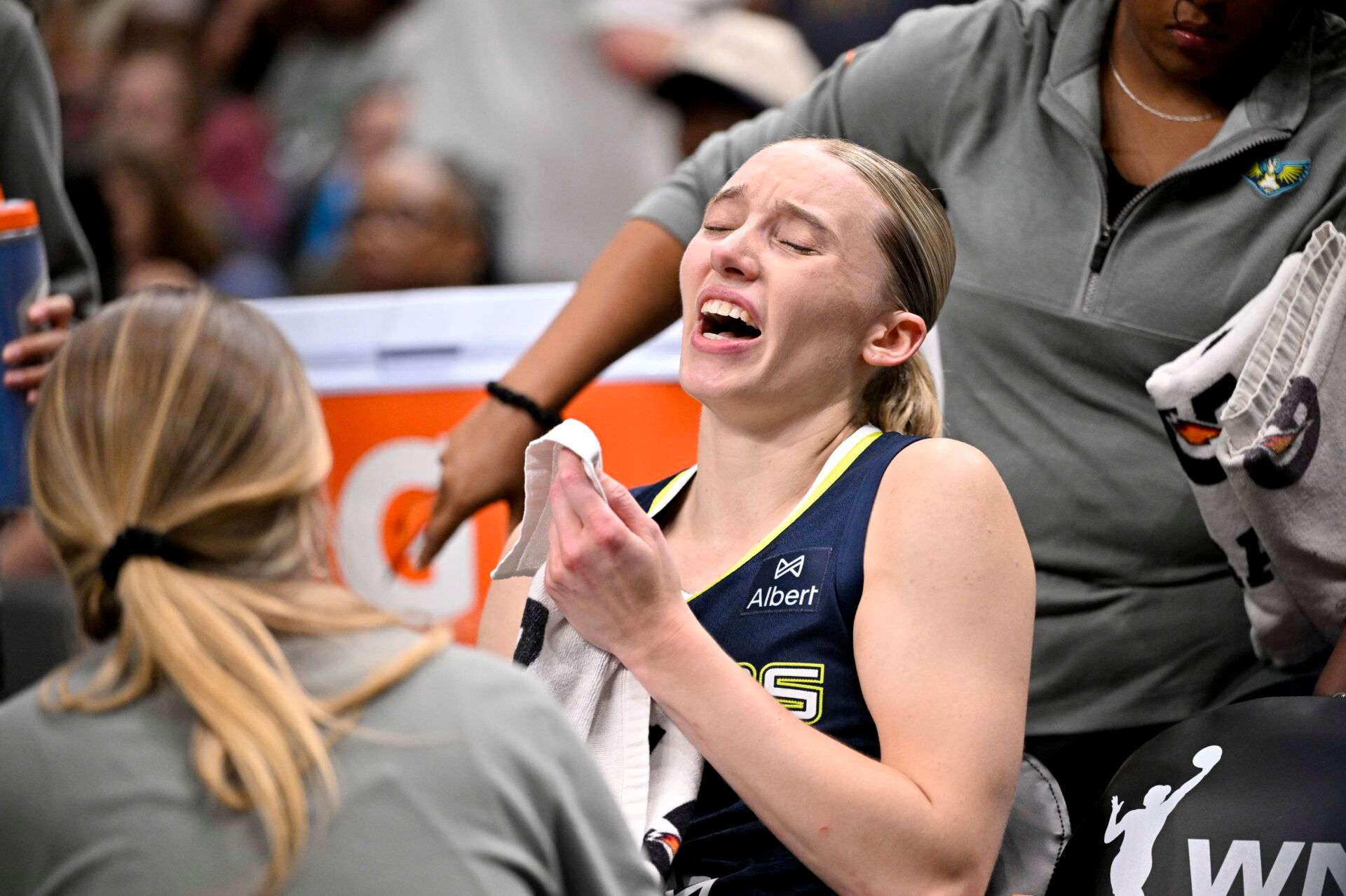 Dallas Wings guard Paige Bueckers (5) sits on the team bench after suffering an apparent leg injury during the second half against the Indiana Fever at the American Airlines Center.