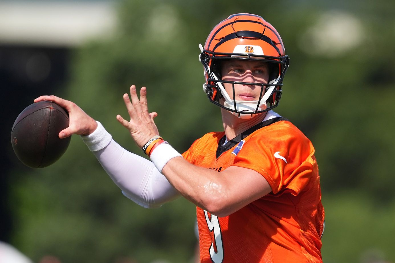 Cincinnati Bengals quarterback Joe Burrow (9) throws during training camp practice.