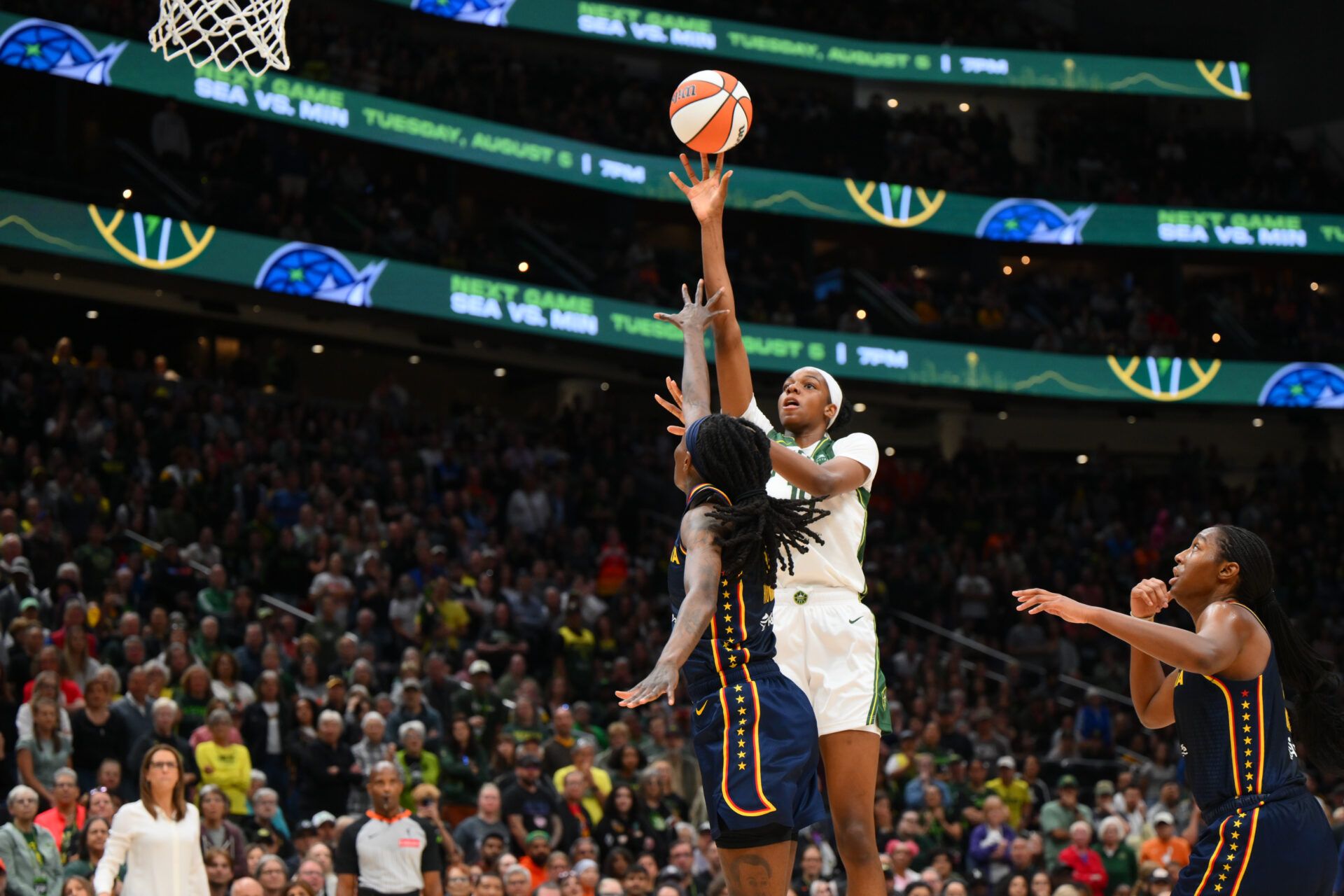 Seattle Storm center Dominique Malonga (14) shoots the ball over Indiana Fever forward Natasha Howard (6) during the second half at Climate Pledge Arena.