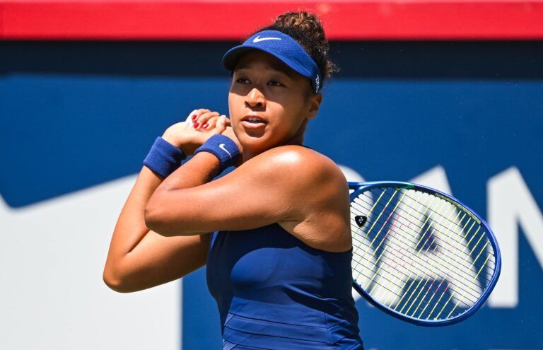 Naomi Osaka (JPN) returns the ball to Jelena Ostapenko (LAT) in third round play at IGA Stadium.