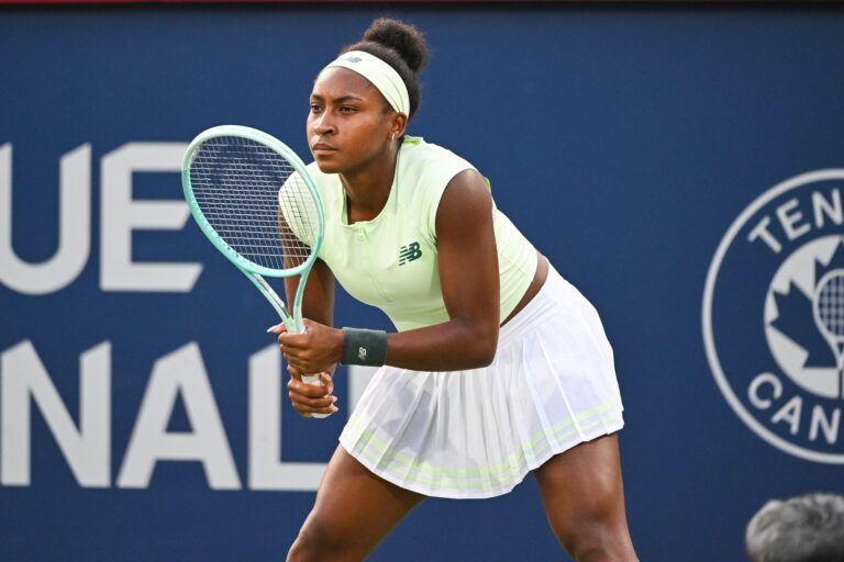 Coco Gauff (USA) waits for Victoria Mboko (CAN) to serve the ball in fourth round play at IGA Stadium.