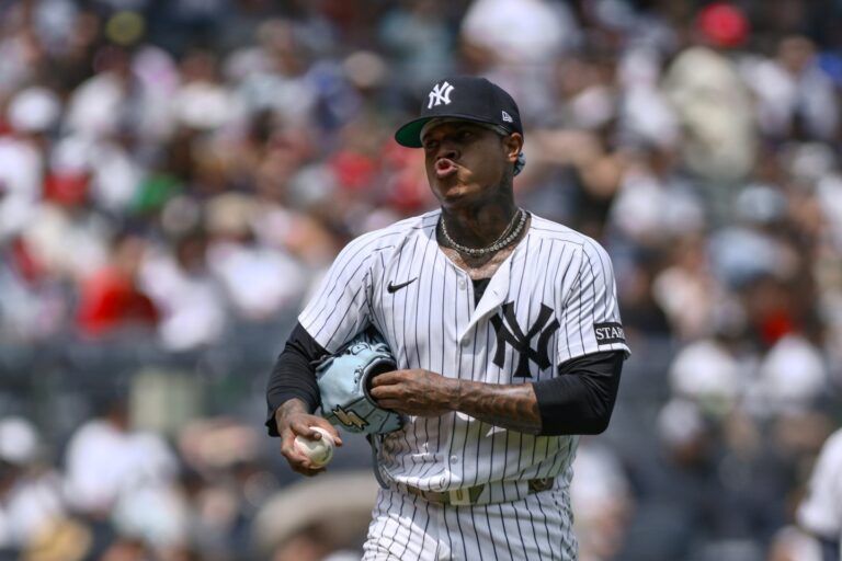 New York Yankees pitcher Marcus Stroman (0) reacts after walking Philadelphia Phillies outfielder Johan Rojas (not pictured) with the bases loaded to surrender a run during the fourth inning at Yankee Stadium.