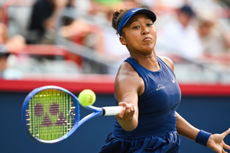 Naomi Osaka (JPN) returns the ball to Anastasija Sevastova (LAT) in fourth round play at IGA Stadium.