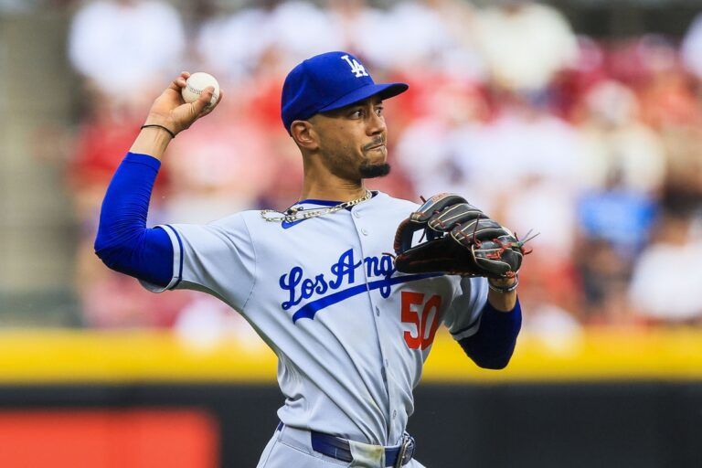Los Angeles Dodgers shortstop Mookie Betts (50) throws to first to get Cincinnati Reds outfielder Austin Hays (not pictured) out in the third inning at Great American Ball Park.