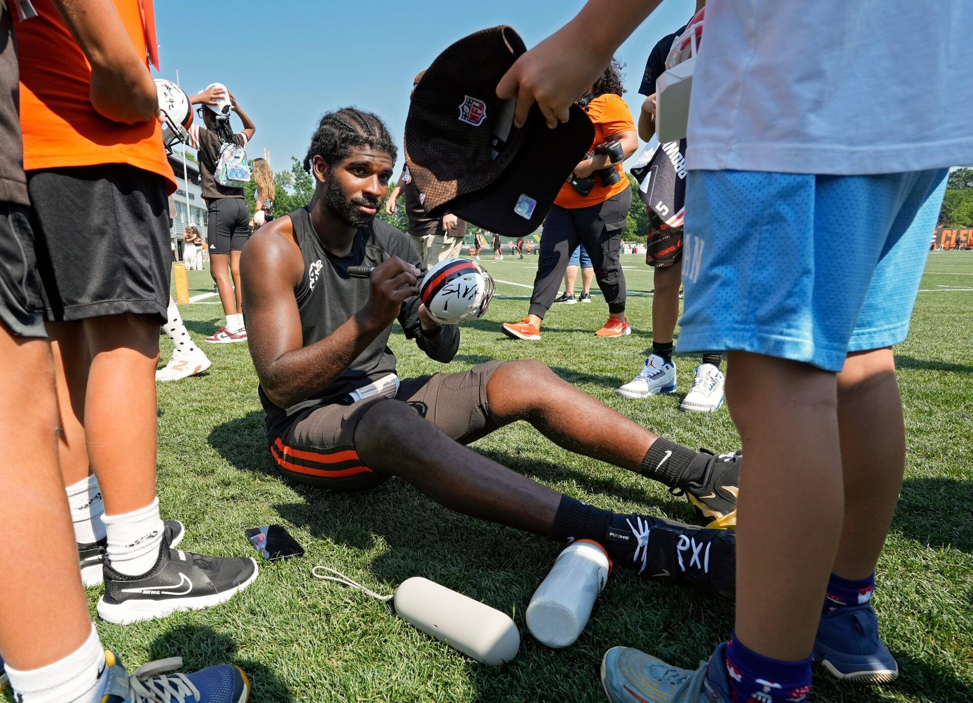 Cleveland Browns quarterback Shedeur Sanders (12) signs autographs for football fans after day eight of NFL training camp at CrossCountry Mortgage Campus, Friday, Aug. 1, 2025, in Berea, Ohio.