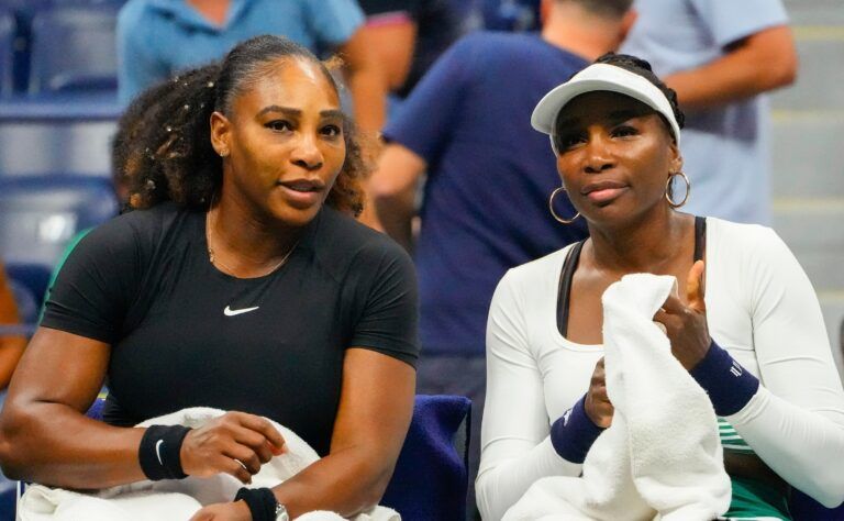 Serena Williams and Venus Williams of the USA on a change of ends as they play Lucie Hradecka and Linda Noskova of the Czech Republic in in women's doubles on day four of the 2022 U.S. Open tennis tournament at USTA Billie Jean King National Tennis Center.