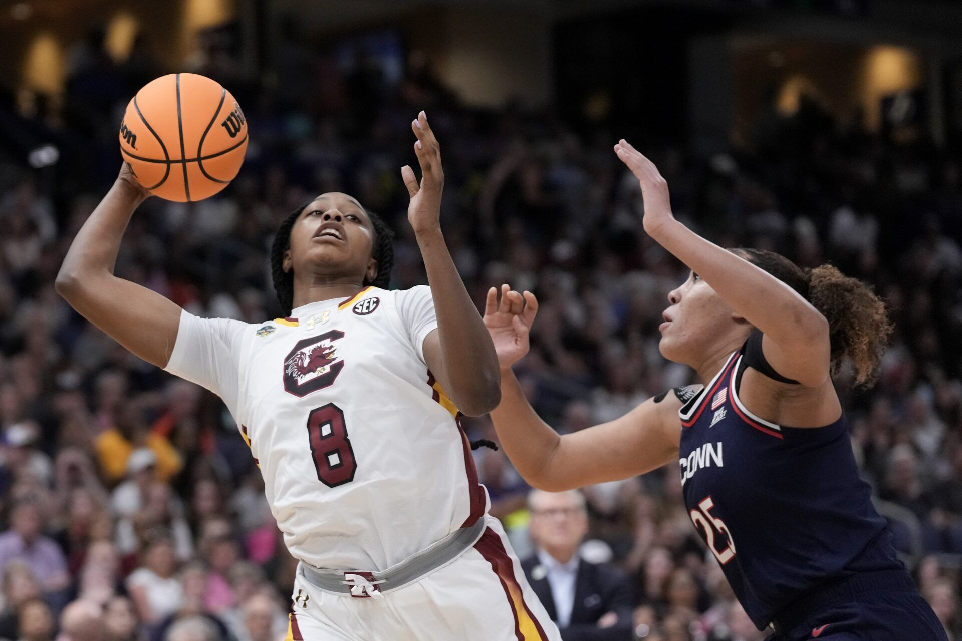 South Carolina Gamecocks forward Joyce Edwards (8) has the ball against Connecticut Huskies forward Ice Brady (25) during the first half of the national championship of the women's 2025 NCAA tournament at Amalie Arena.