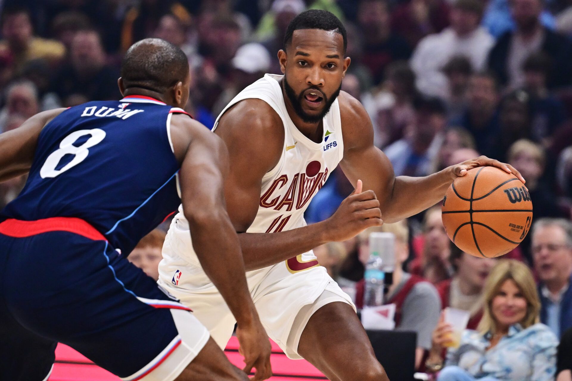 Cleveland Cavaliers forward Evan Mobley (4) drives to the basket against Los Angeles Clippers guard Kris Dunn (8) during the first quarter at Rocket Arena.