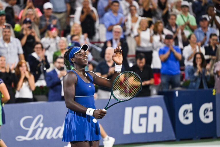 Victoria Mboko (CAN) salutes the crowd after her quarterfinal match win against Jessica Bouzas Maneiro (ESP) at IGA Stadium.