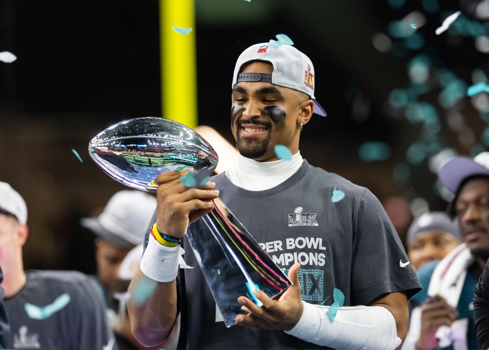 Philadelphia Eagles quarterback Jalen Hurts (1) celebrates with the Vince Lombardi Trophy after defeating the Kansas City Chiefs during Super Bowl LIX at Ceasars Superdome.