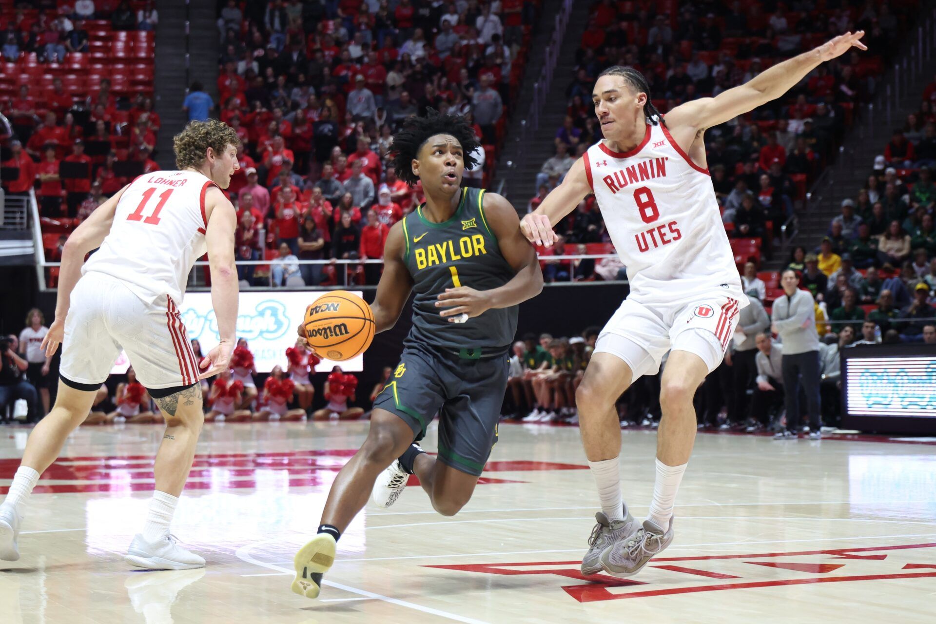 Baylor Bears guard Robert Wright III (1) drives to the basket against Utah Utes forward Keanu Dawes (8) during the first half at Jon M. Huntsman Center.