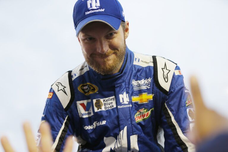 Sprint Cup Series driver Dale Earnhardt Jr. (88) shanks fans hands during driver introductions at Richmond International Raceway.
