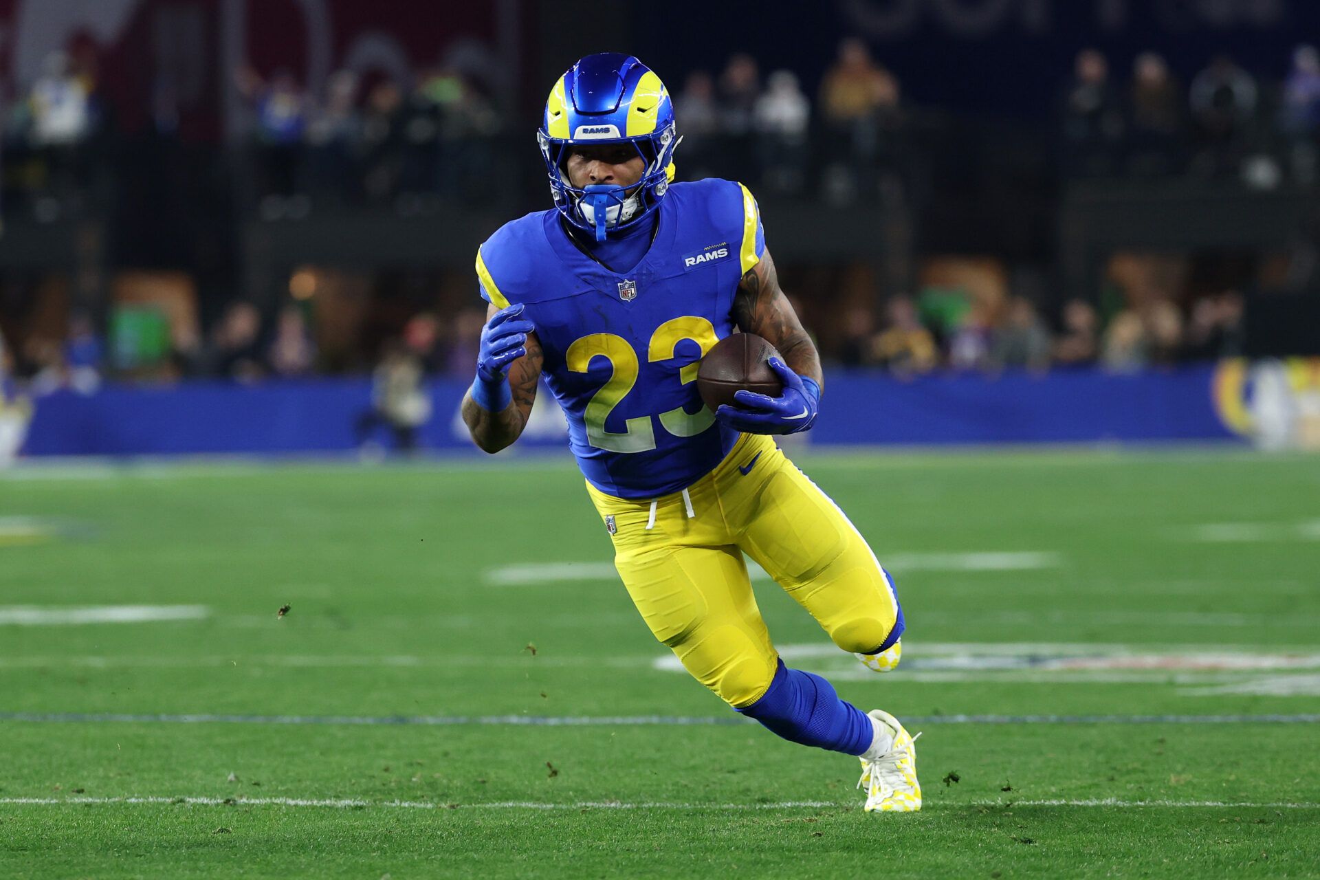 Los Angeles Rams running back Kyren Williams (23) rushes the ball against the Minnesota Vikings during the first half in an NFC wild card game at State Farm Stadium.