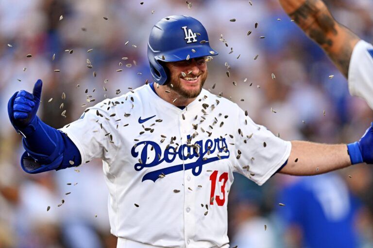 Los Angeles Dodgers third baseman Max Muncy (13) celebrates after hitting a home run during the first inning against the St. Louis Cardinals at Dodger Stadium.