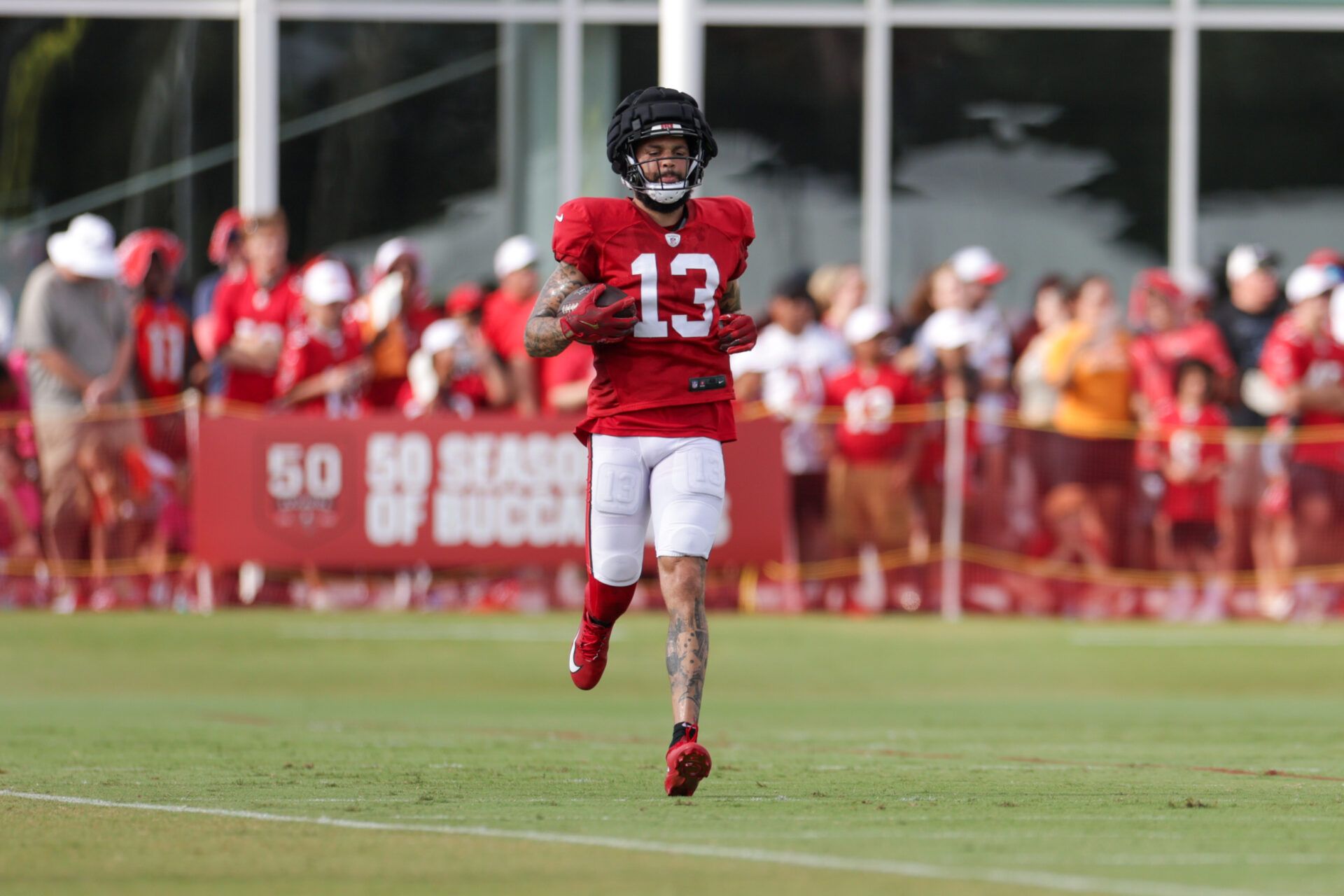 Tampa Bay Buccaneers wide receiver Mike Evans (13) participates in training camp at AdventHealth Training Center.