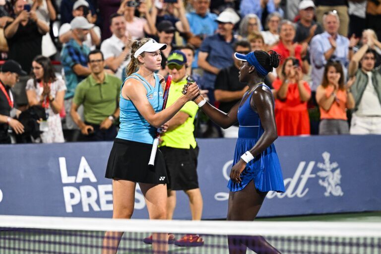 Elena Rybakina (KAZ) congratulates semifinal winner Victoria Mboko (CAN) after the end of the match at IGA Stadium.