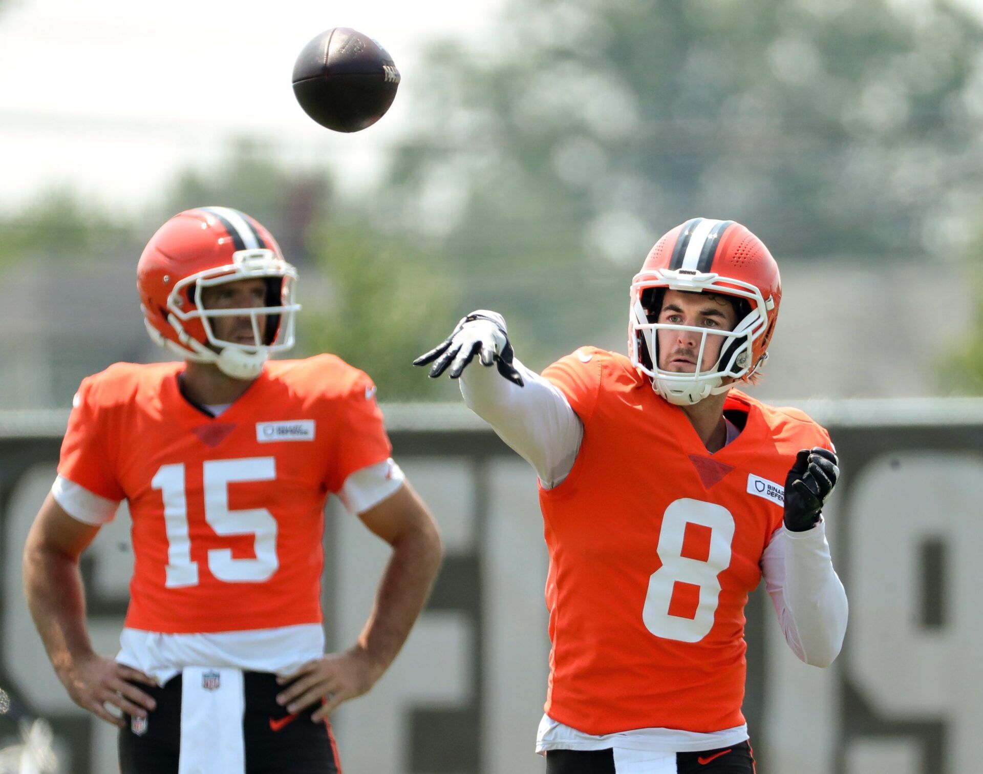 Cleveland Browns quarterback Kenny Pickett (8) throws as quarterback Joe Flacco (15) looks on during NFL training camp at CrossCountry Mortgage Campus, Friday, Aug. 1, 2025, in Berea, Ohio.