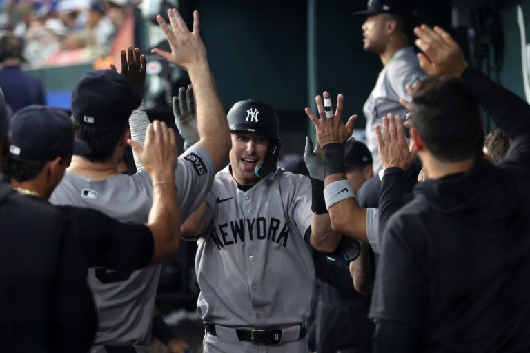 New York Yankees first baseman Paul Goldschmidt (48) is congratulated by his teammates after hitting a solo home run during the seventh inning against the Texas Rangers at Globe Life Field.