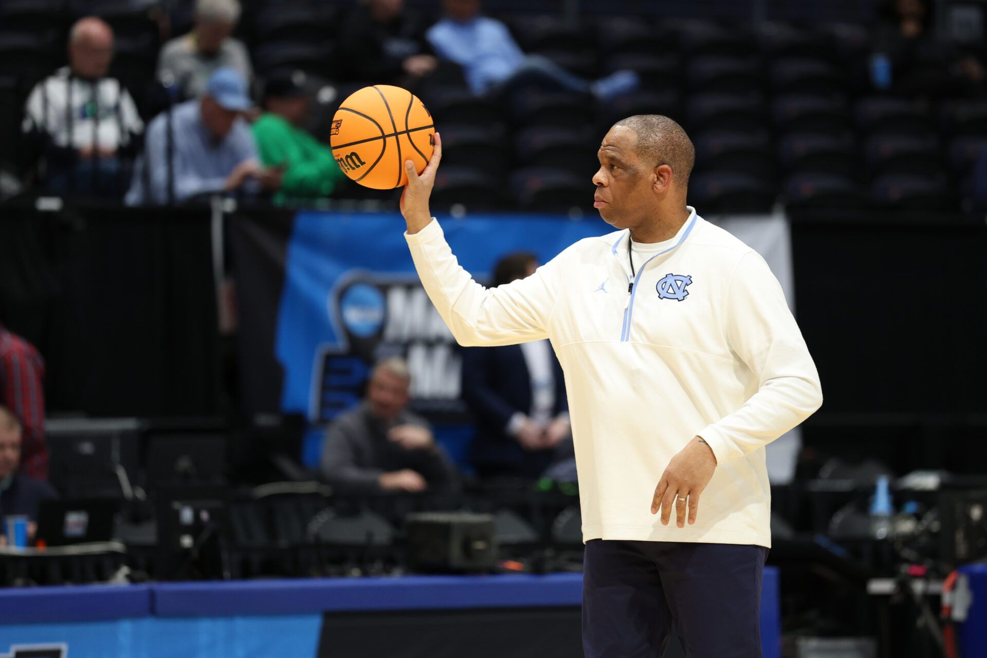 North Carolina Tar Heels head coach Hubert Davis passes the ball during the First Four Practice at UD Arena.