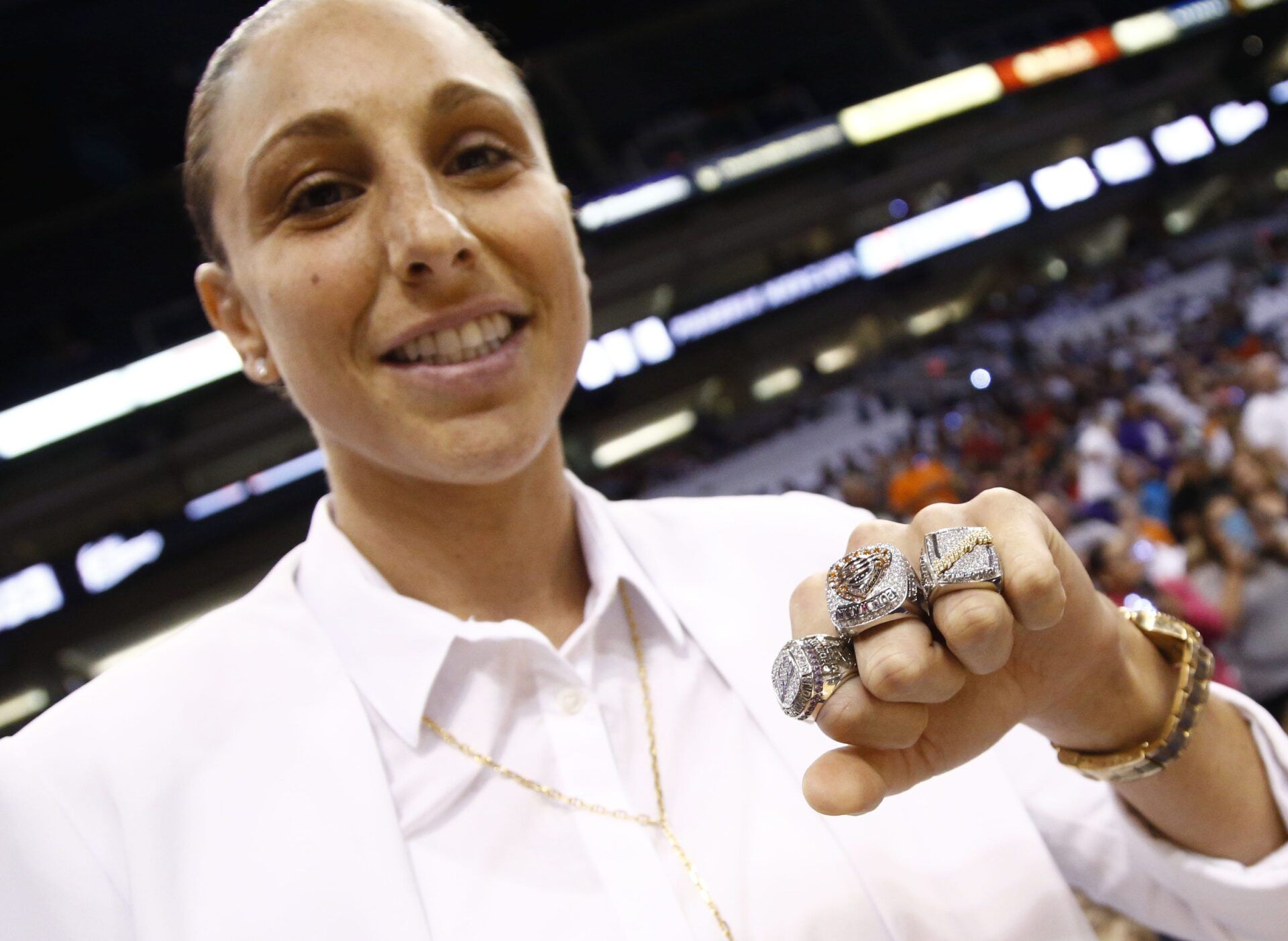 Phoenix Mercury star Diana Taurasi shows off her three WNBA Championship rings during ceremonies at the season opener on June 5, 2015, at US Airways Center in Phoenix.