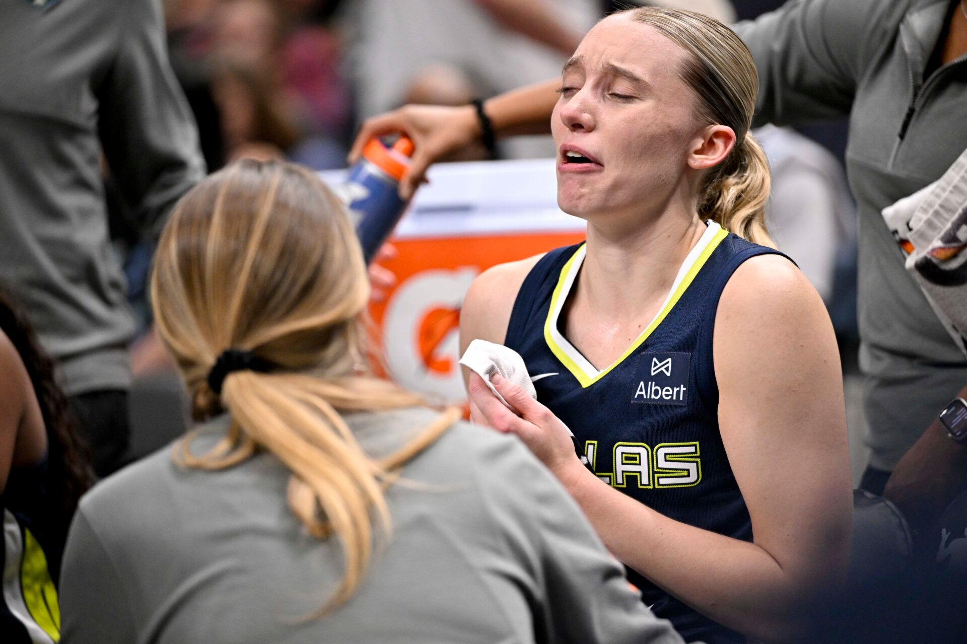 Dallas Wings guard Paige Bueckers (5) sits on the team bench after suffering an apparent leg injury during the second half against the Indiana Fever at the American Airlines Center.