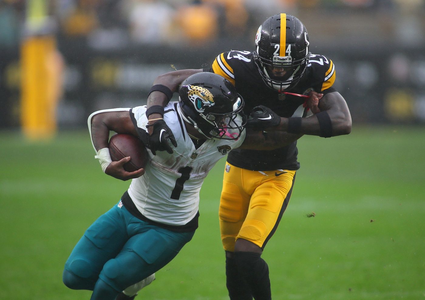 Pittsburgh Steelers Joey Porter Jr. (24) wraps up Jacksonville Jaguars Travis Etienne Jr. (1) during the first half at Acrisure Stadium in Pittsburgh, PA on October 29, 2023.