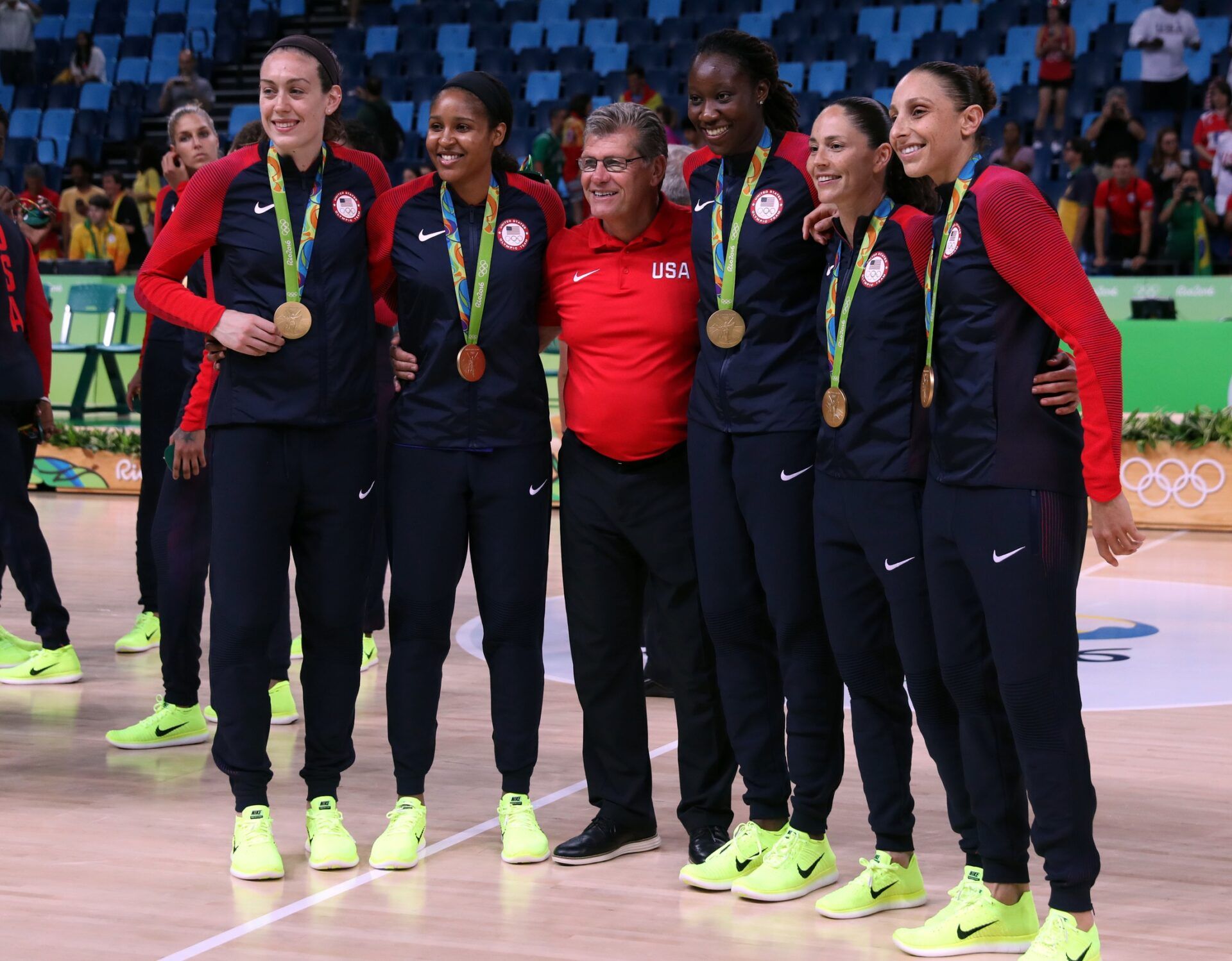USA forward/center Breanna Stewart (9), USA forward Maya Moore (7), USA head coach Geno Auriemma, USA center Tina Charles (14), USA guard Sue Bird (6) and USA guard Diana Taurasi (12) pose for a picture after beating Spain in the women's basketball gold medal match during the Rio 2016 Summer Olympic Games at Carioca Arena 1.