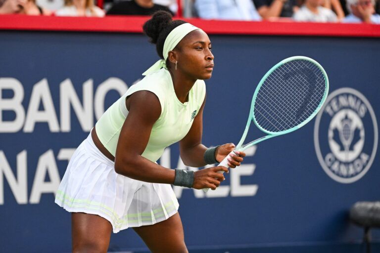 Coco Gauff (USA) waits for Victoria Mboko (CAN) to serve the ball in fourth round play at IGA Stadium.
