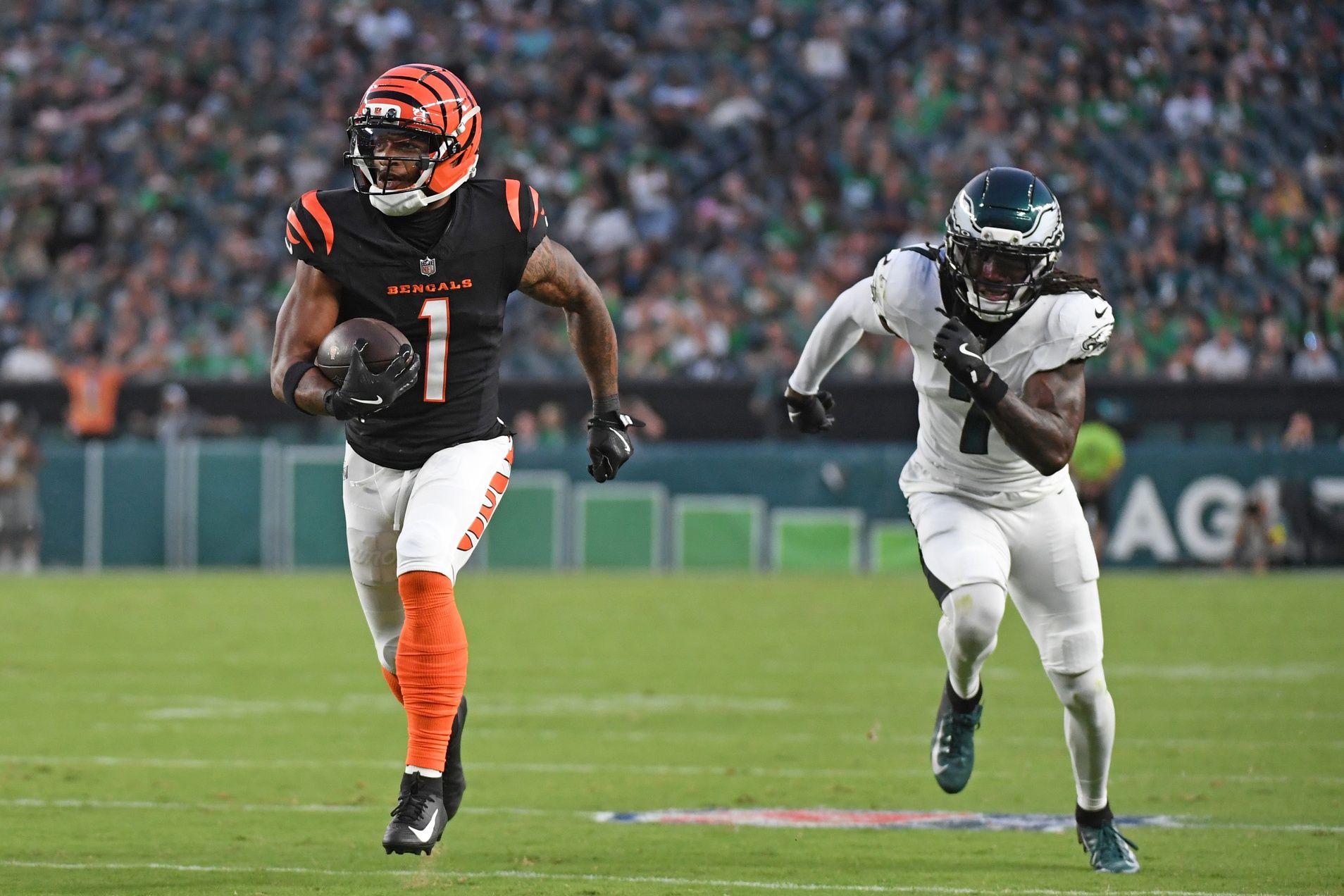 Cincinnati Bengals wide receiver Ja'Marr Chase (1) runs past Philadelphia Eagles cornerback Kelee Ringo (7) on a 36-yard touchdown catch during the first quarter against the Philadelphia Eagles at Lincoln Financial Field.