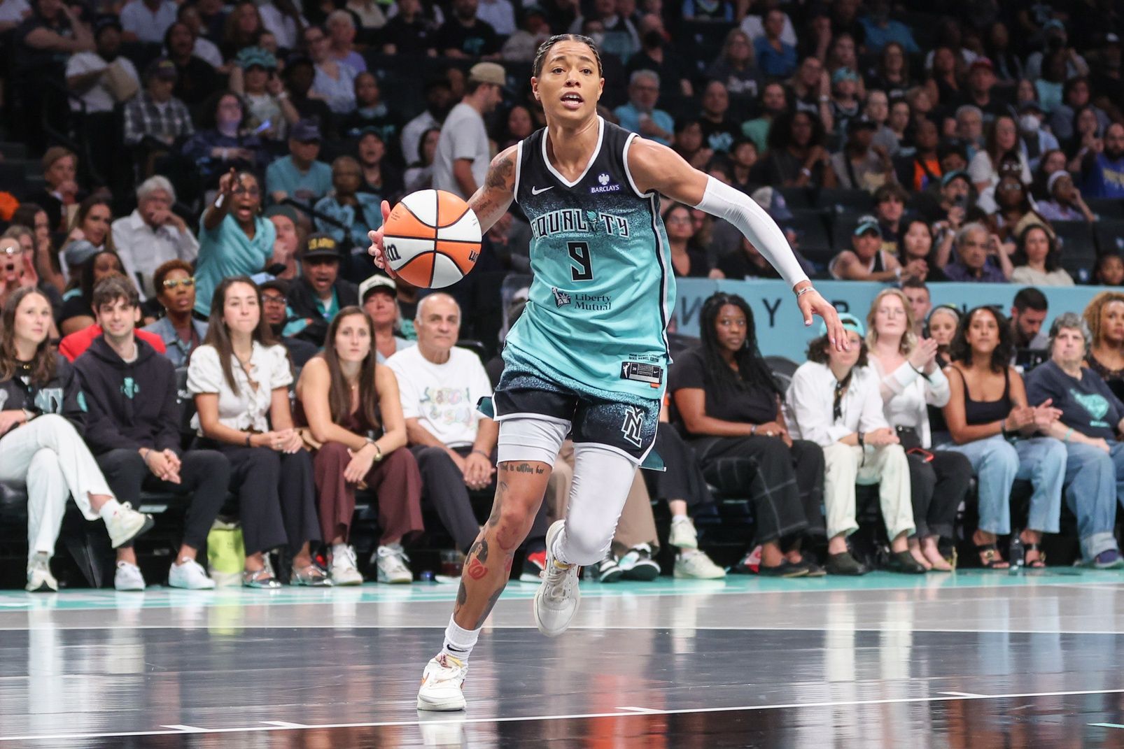 New York Liberty guard Natasha Cloud (9) drives to the basket in the third quarter against the Dallas Wings at Barclays Center.
