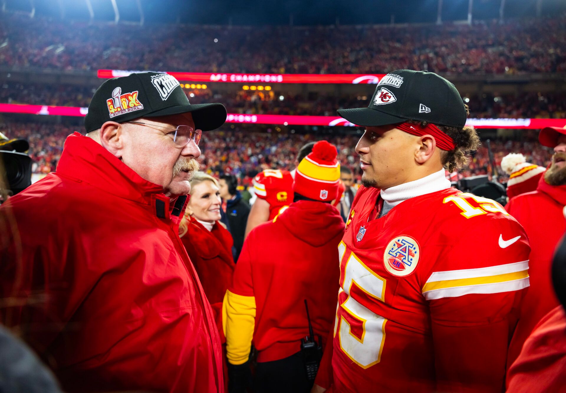 Kansas City Chiefs head coach Andy Reid (left) with quarterback Patrick Mahomes (15) after defeating the Buffalo Bills in the AFC Championship game at GEHA Field at Arrowhead Stadium.