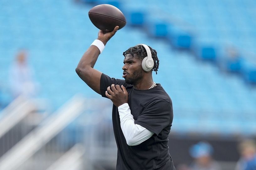 Cleveland Browns quarterback Shedeur Sanders (12) throws the ball  during pregame warm ups against the Carolina Panthers at Bank of America Stadium.