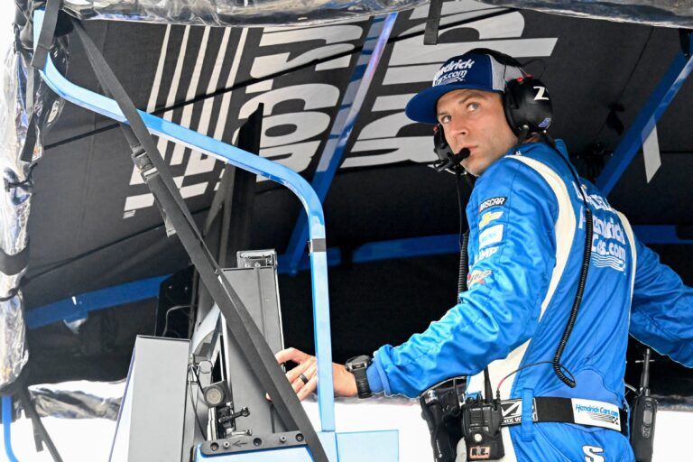 NASCAR Cup Series driver Kyle Larson (5) crew chief Cliff Daniels looks out of his pit box Sunday, July 27, 2025, during the Brickyard 400 at Indianapolis Motor Speedway.