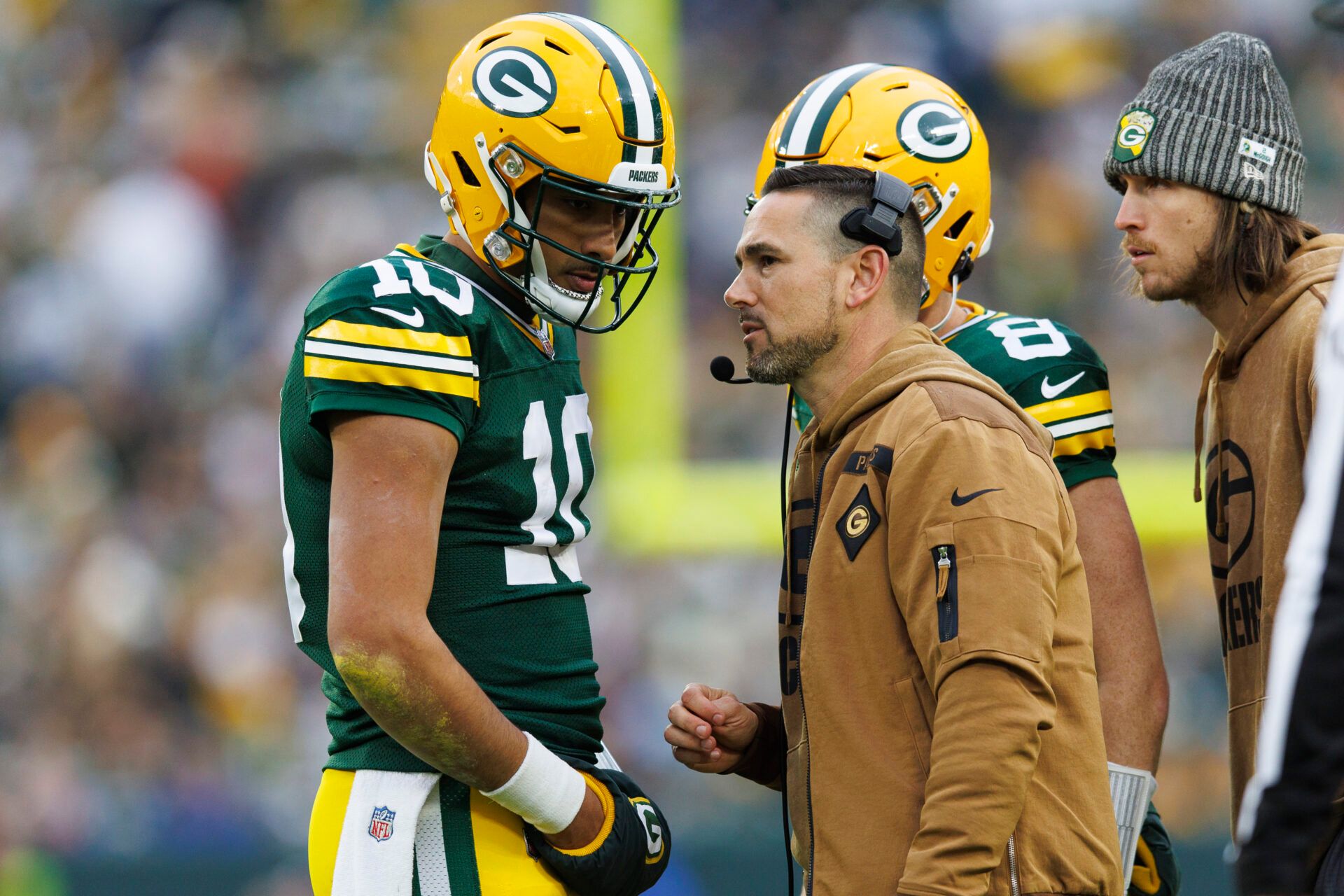 Green Bay Packers head coach Matt LaFleur talks with quarterback Jordan Love (10) during the second quarter against the Los Angeles Rams at Lambeau Field.