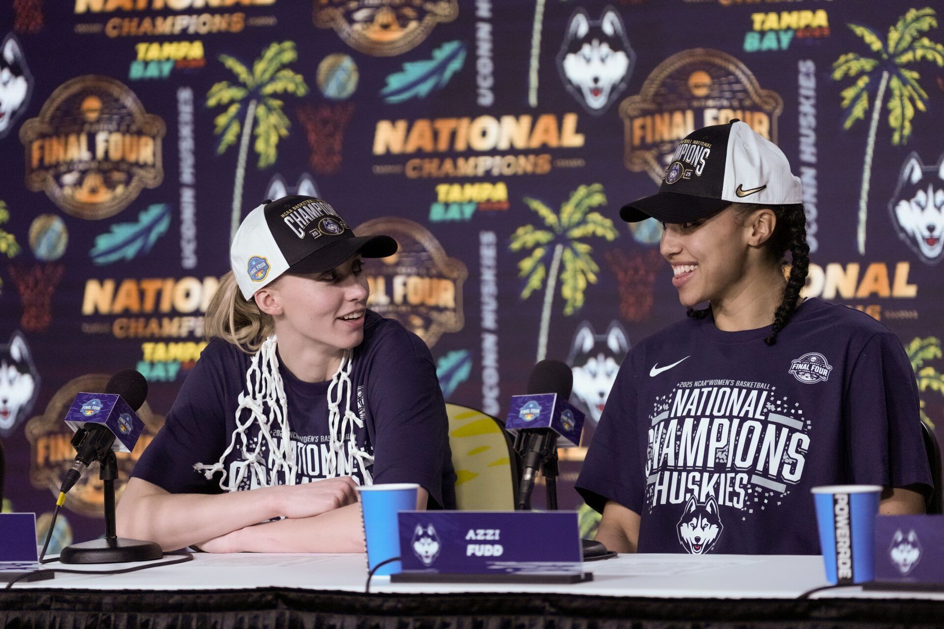 Connecticut Huskies guard Paige Bueckers (5) and guard Azzi Fudd (35) speak to the media after the national championship of the women's 2025 NCAA tournament against the South Carolina Gamecocks at Amalie Arena.