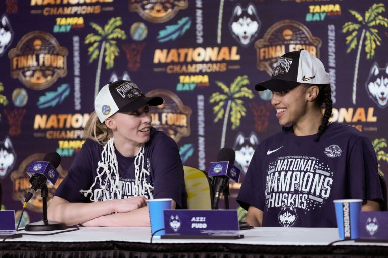 Connecticut Huskies guard Paige Bueckers (5) and guard Azzi Fudd (35) speak to the media after the national championship of the women's 2025 NCAA tournament against the South Carolina Gamecocks at Amalie Arena.