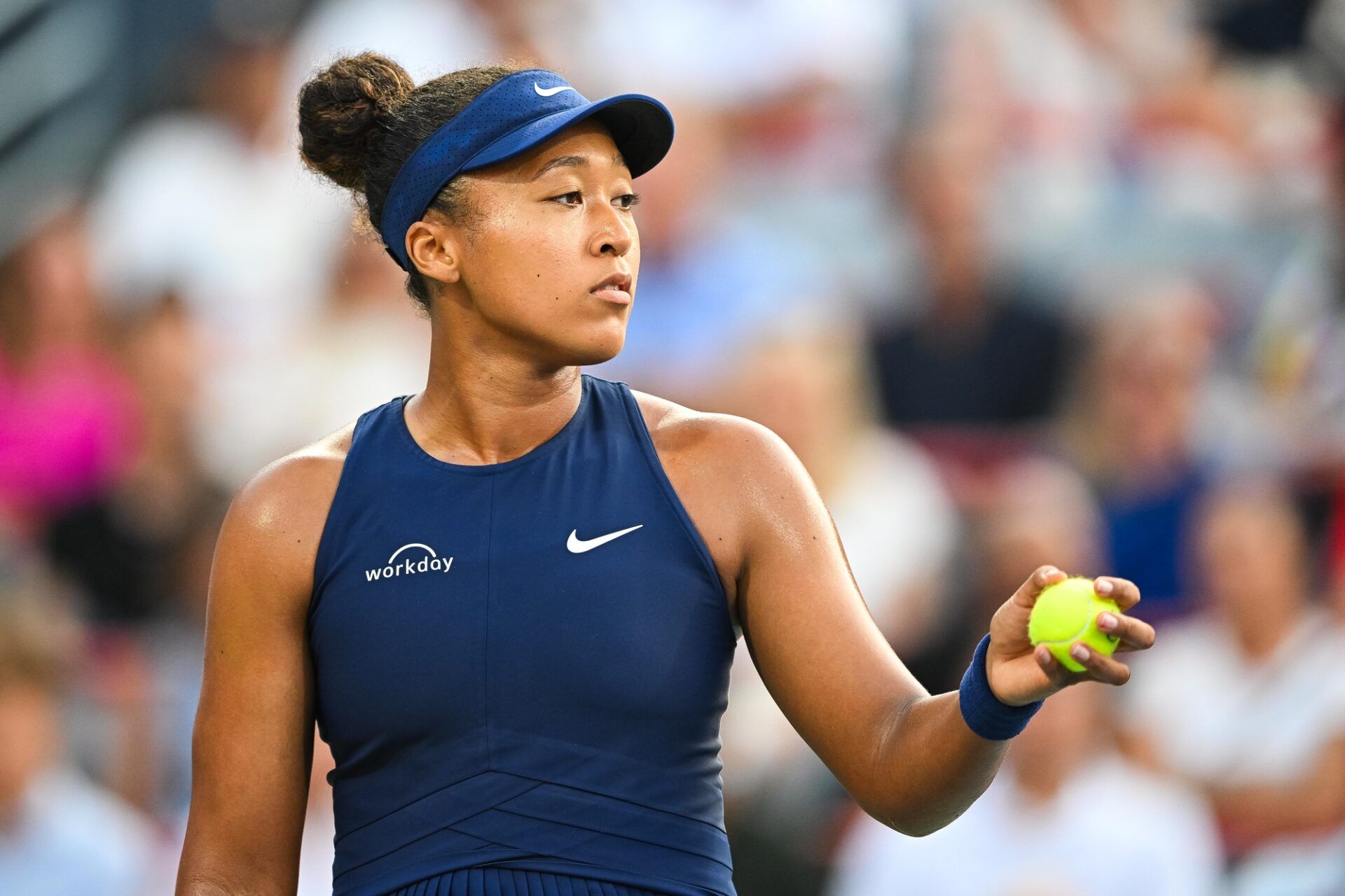 Naomi Osaka (JPN) gets ready to serve the ball to Victoria Mboko (CAN) during singles final play at IGA Stadium.