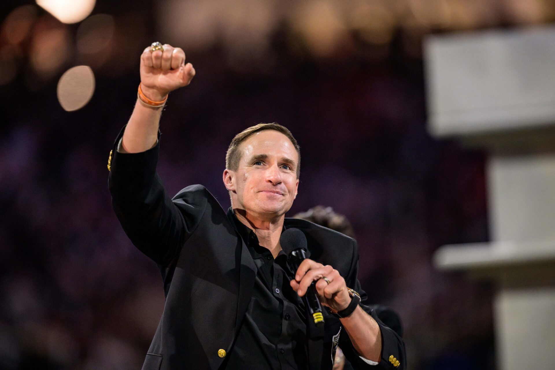 New Orleans Saints retired quarterback Drew Brees (9) reacts during his hall of fame ceremony at halftime against the Denver Broncos at Caesars Superdome.