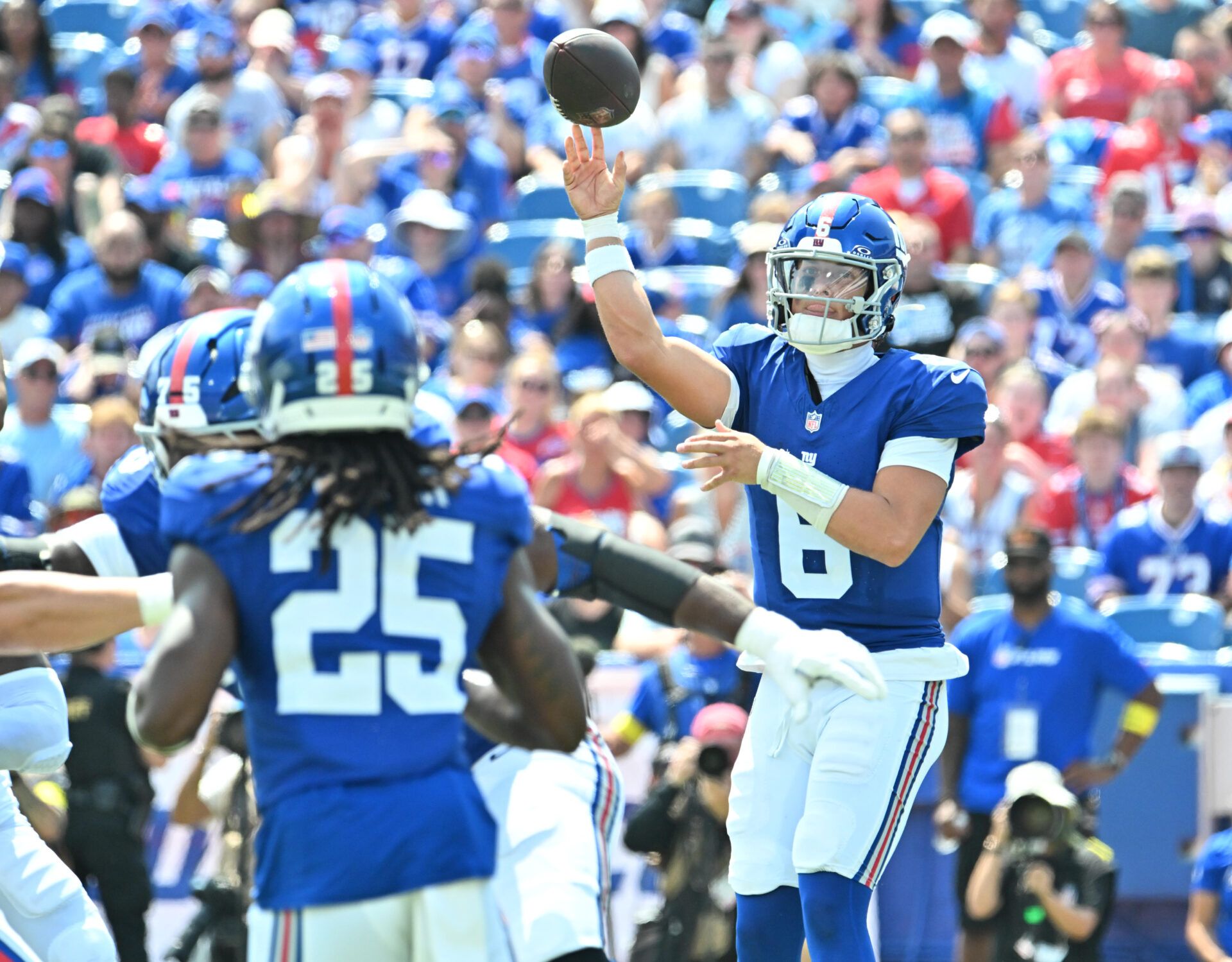 New York Giants quarterback Jaxson Dart (6) throws a pass to running back Dante Miller (25) in the second quarter game against the Buffalo Bills at Highmark Stadium.