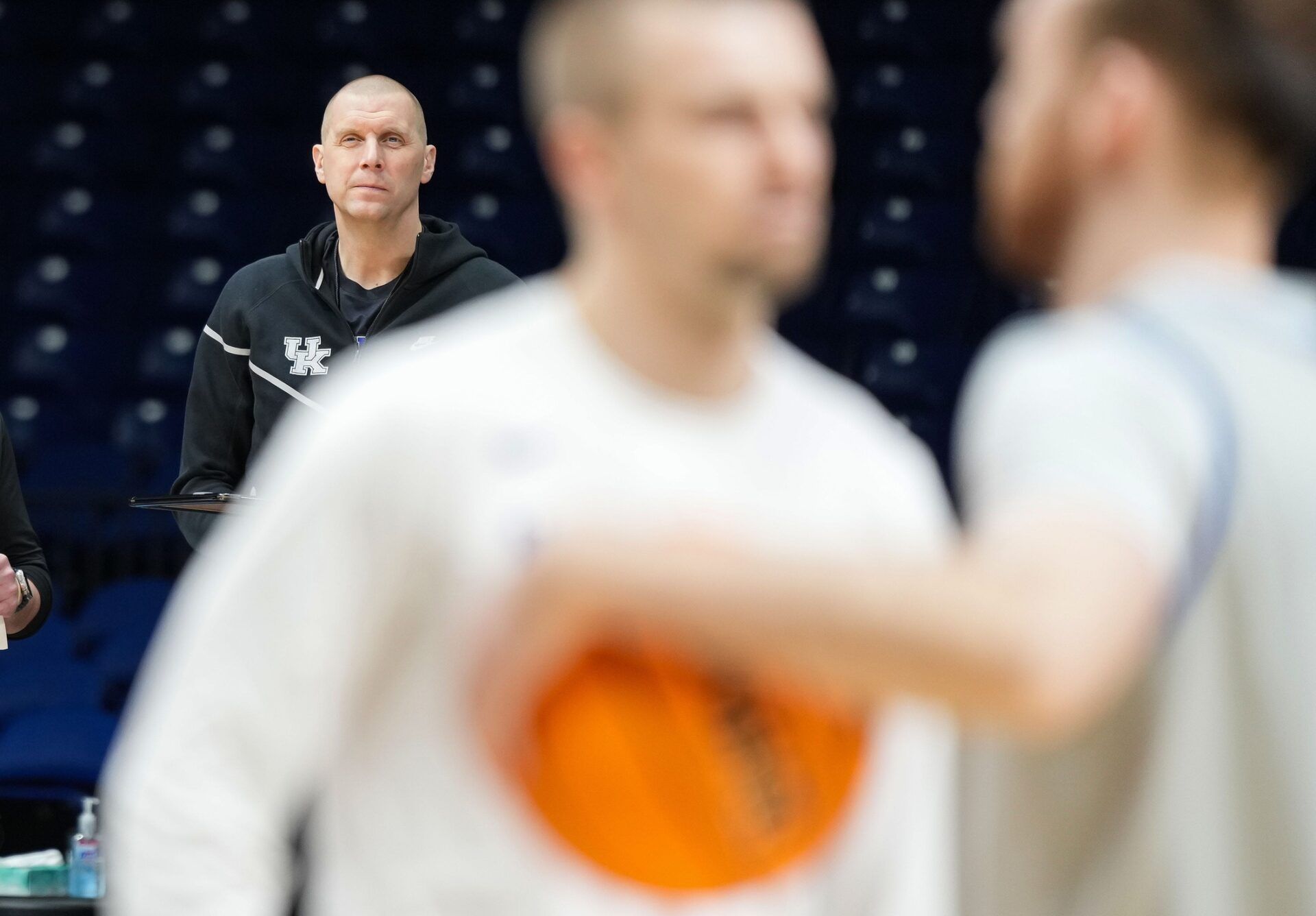 Kentucky Wildcats head coach Mark Pope watches players shoot around Thursday, March 27, 2025, during practice ahead of the Sweet 16 March Madness tournament game against the Tennessee Volunteers at Lucas Oil Stadium in Indianapolis.
