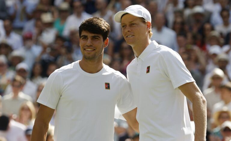 Carlos Alcaraz (ESP)(L) and Jannik Sinner (ITA)(R) pose for a picture prior to their gentlemen's' singles final of The Championships Wimbledon 2025 at All England Lawn Tennis and Croquet Club.