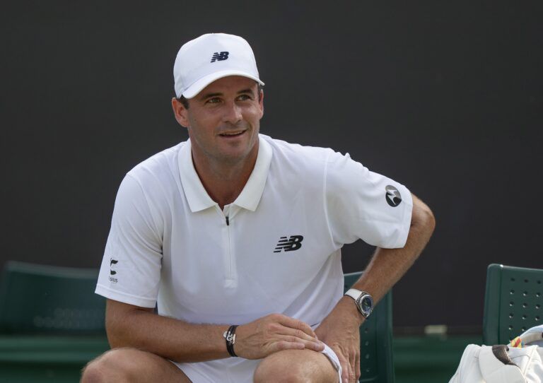 Tommy Paul of the United States receives treatment during a medical time out during his match against Sebastian Ofner of Austria on day four at the All England Lawn Tennis and Croquet Club.